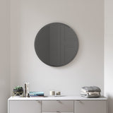 A Hub Mirror - Bevy 24inch - Smoke from the Umbra range hanging above a white dresser.