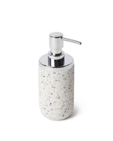 A Junip Soap Pump - Terrazzo from the Umbra brand, designed by Gensler, placed on a sleek white surface.