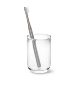 A Junip Tumbler - Acrylic toothbrush by Umbra on a white background.