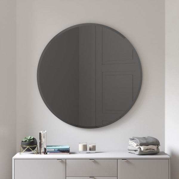 A Hub Mirror - Bevy 36" - Smoke from Umbra is hanging above a versatile white dresser from the Umbra range.