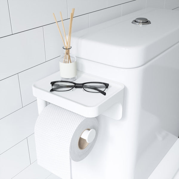 A toilet with a FLEX SURELOCK TOILET PAPER HOLDER featuring Umbra's sure-lock technology.