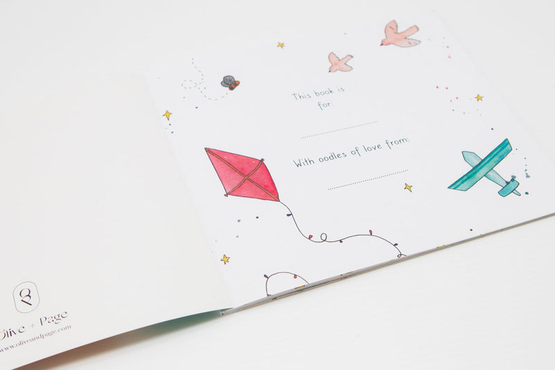 A children's book featuring illustrations of planes and kites, called "BEFORE YOU WERE HERE" by Olive + Page.