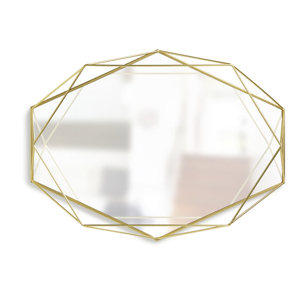 A contemporary geometric mirror from the Prisma Mirror - Brass collection by Umbra.