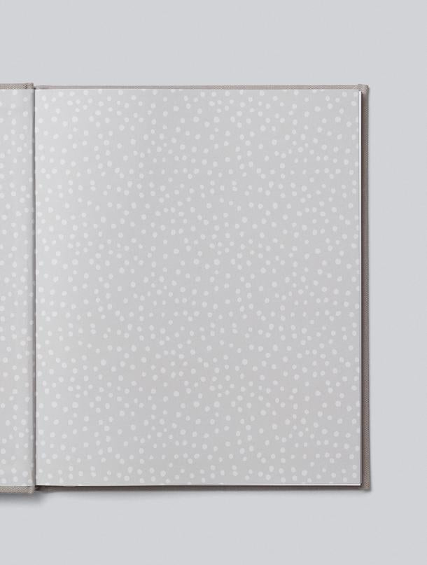 A grey journal with white dots on it, perfect for capturing memories over 21 years of you, by Write To Me.