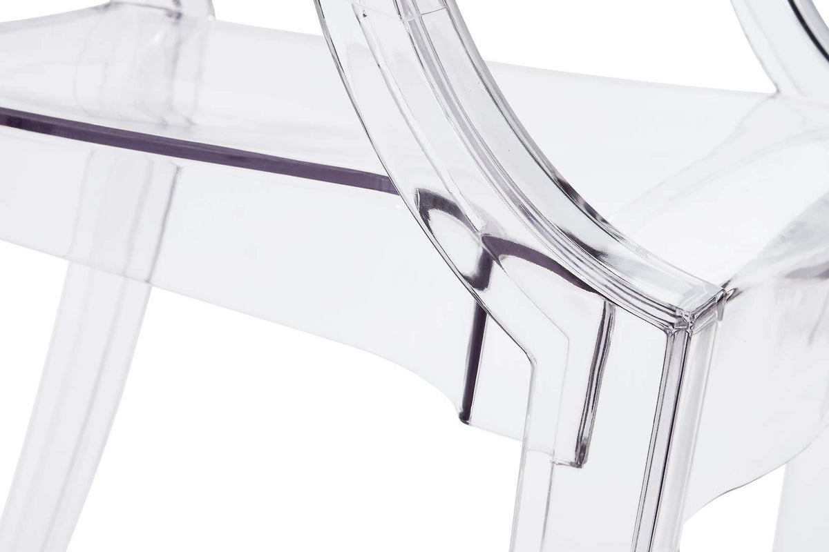 Close view of the moulded junction where the arm, seat and back of the clear chair meet