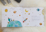 A children's book with a space theme and a teddy bear, called "MY WISHES FOR YOU" by Olive + Page.