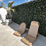 Two Brel Club THE RATTAN LOUNGER – LARGE beach loungers in front of a hedge.