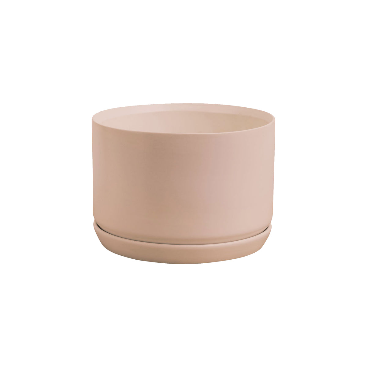 A small pink Potted Oslo Planter - Peach on a white background.