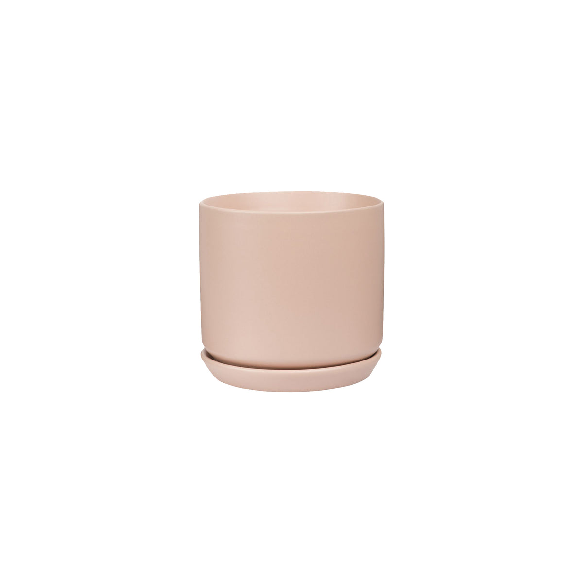 A small pink stoneware Oslo Planter - Peach, by Potted, on a white background.