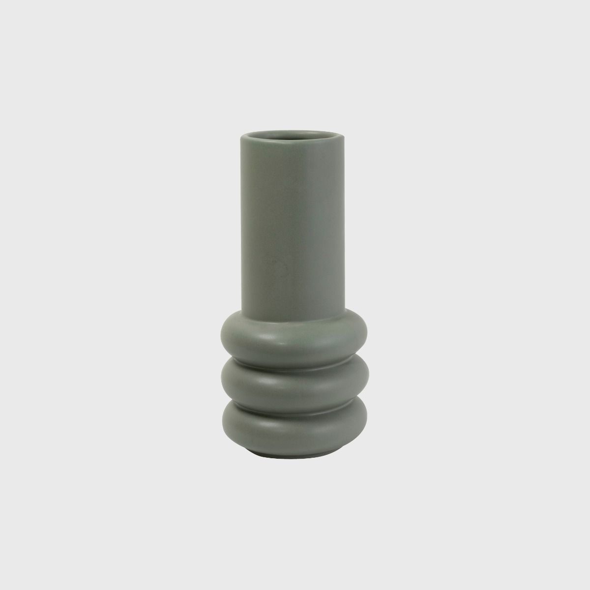 The Potted Milan Vase, a décor statement, stands out with its vibrant green color against a clean white background.