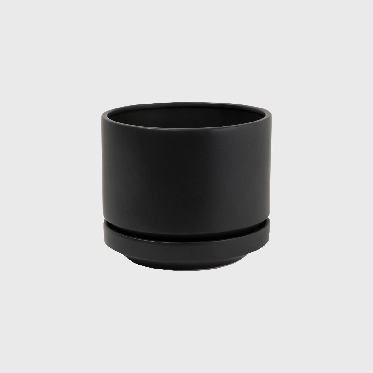 Black Zurich ceramic planter with its saucer on a white background