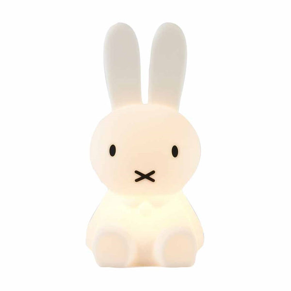 A medium-sized, white bunny sitting on a white surface, inspired by Mr Maria's Miffy Star Light - DIMMABLE, MOOD LIGHTING design.