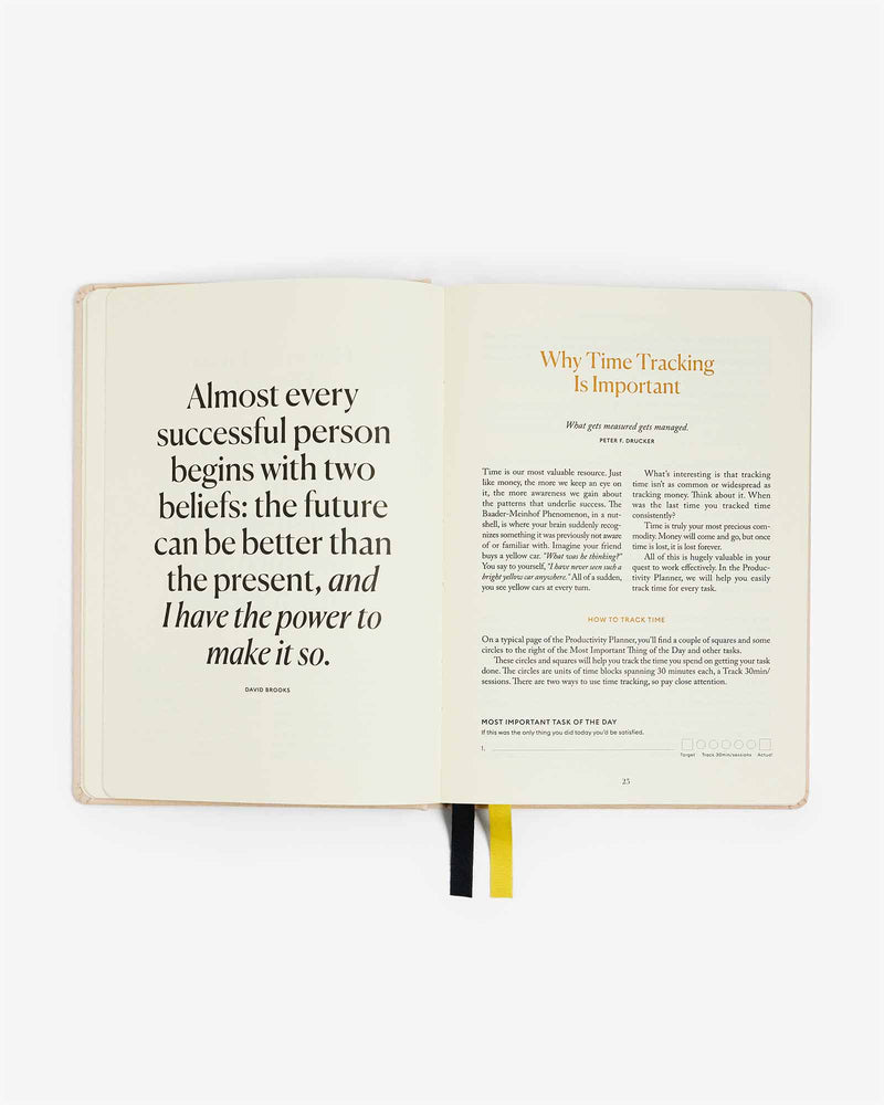 An open book with a quote on it that serves as an Intelligent Change Productivity Planner for focus time.