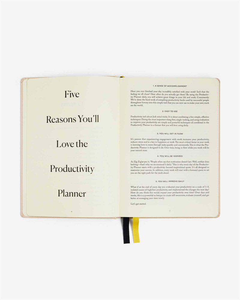 An open book highlighting the top five reasons you'll love the Intelligent Change Productivity Planner for enhanced focus time and overcoming procrastination.