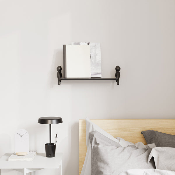 A versatile bed with a decorative shelf and Umbra Buddy Wall Shelf - Black / White.