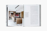 An open HARE + KLEIN INTERIOR book with an image of a kitchen.