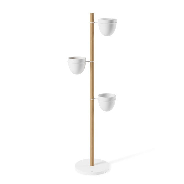 An Umbra Floristand Planter - White/Natural with three pots on it.