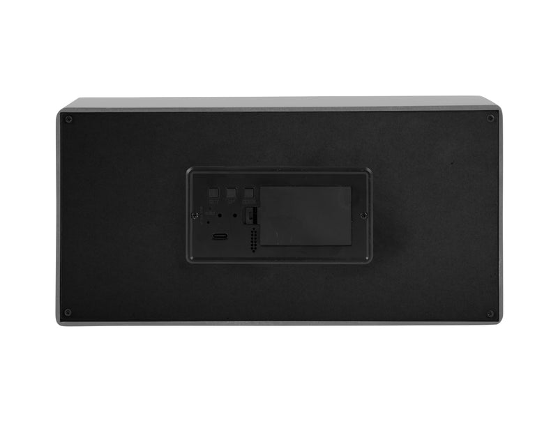 A black Karlsson speaker cabinet with a remote control featuring LED alarm clock functionality.