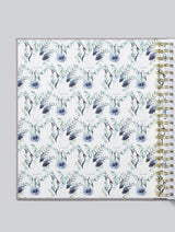 A linen bound spiral notebook BABY | YOUR FIRST FIVE YEARS with a blue floral pattern by Write To Me.