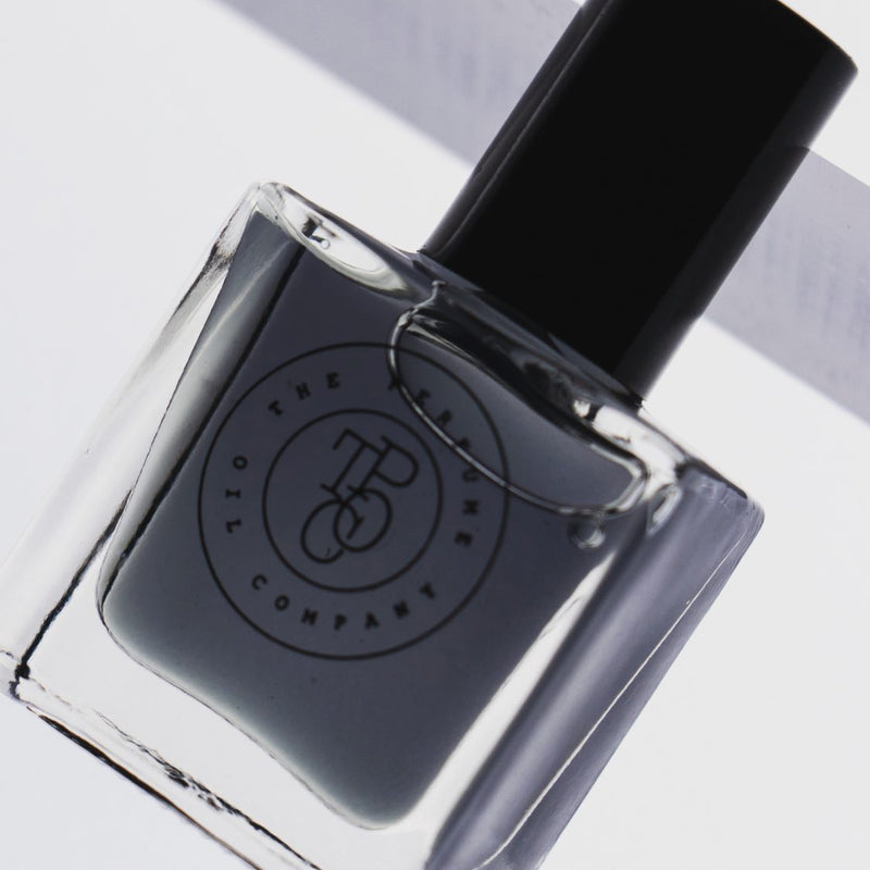 A bottle of SASS, inspired by Black Opium (YSL) cruelty-free nail polish sitting on top of a white surface. (Brand: The Perfume Oil Company)