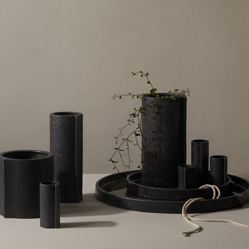A collection of Zakkia's Burlap Vase - Small Black in a minimalist design.