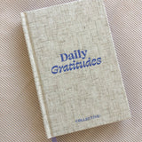 A Collective Hub gratitude journal promoting well-being with the words "Daily Gratitudes Version 2" on it.