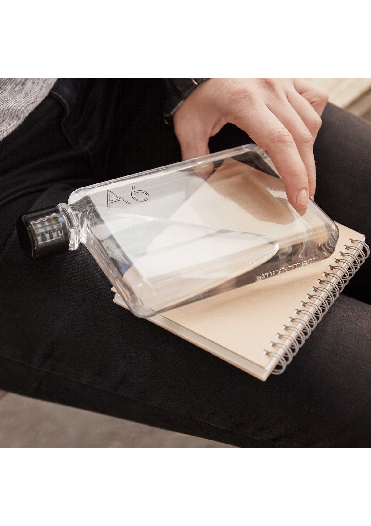 A person with an A6 Memobottle maintaining hydration.