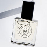 A SALT perfume bottle, inspired by Wood Sage & Sea Salt (Jo Malone), placed on a white box from The Perfume Oil Company.