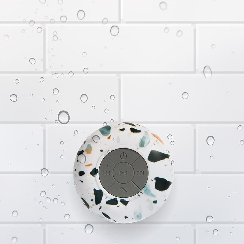 A water-resistant Albi Wireless Shower Speaker - Assorted Natural Prints.