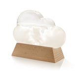 An Albi Cloud Weather Station on a wooden base that serves as a unique weather forecast display, accurately reflecting atmospheric fluctuations.