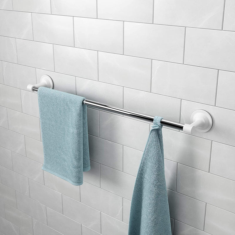 A blue Umbra Flex Sure-Lock towel hook is mounted on a Flex Sure-Lock towel bar chrome in a bathroom.