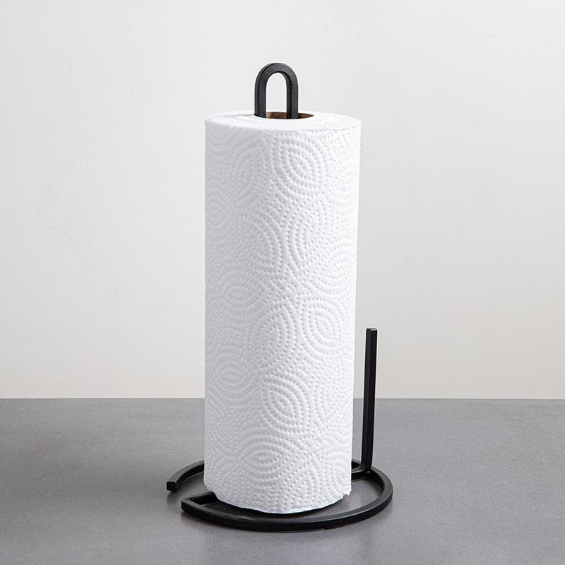 A Umbra SQUIRE COUNTERTOP PAPER TOWEL HOLDER with a roll of paper on it.