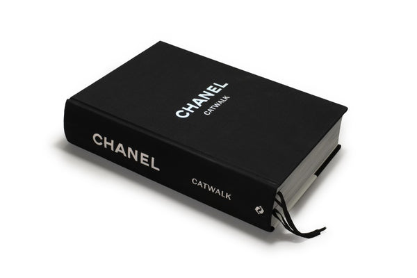 A black CHANEL CATWALK: THE COMPLETE COLLECTIONS book.