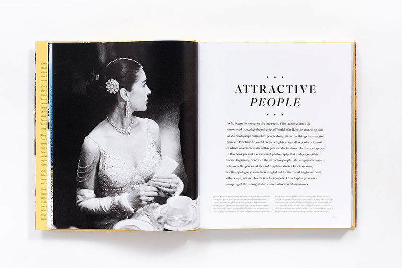An open Slim Aarons: Women book with an image of a woman in a dress.