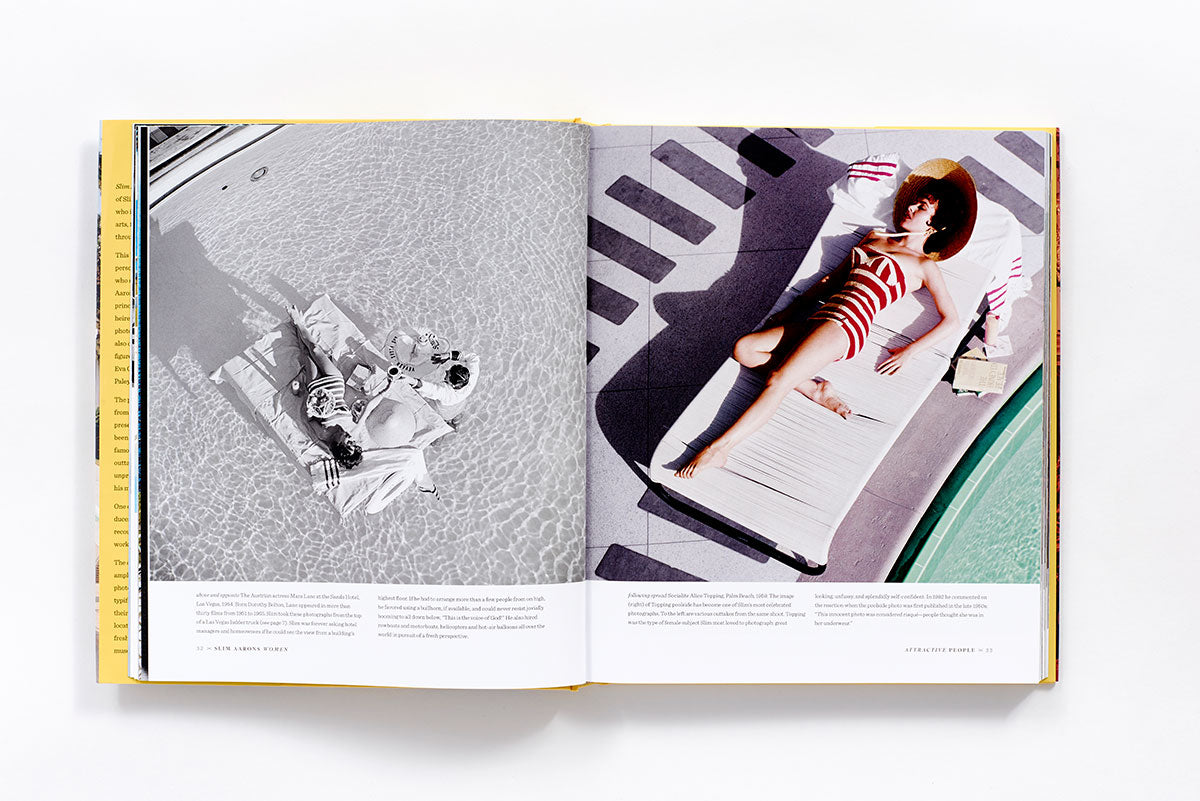 An open book with a picture of Slim Aarons: Women laying on a bed.