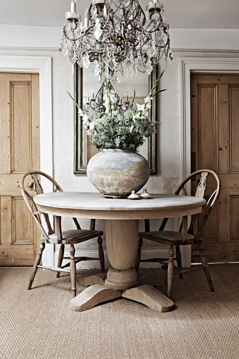 A dining room with a round table, A Life Less Ordinary | Interiors and Inspirations, and chairs.
