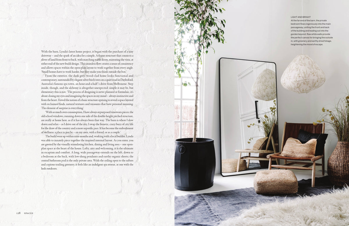 Curate spread with a page of text and a room with a tall mirror, a black planter and a lounge chair
