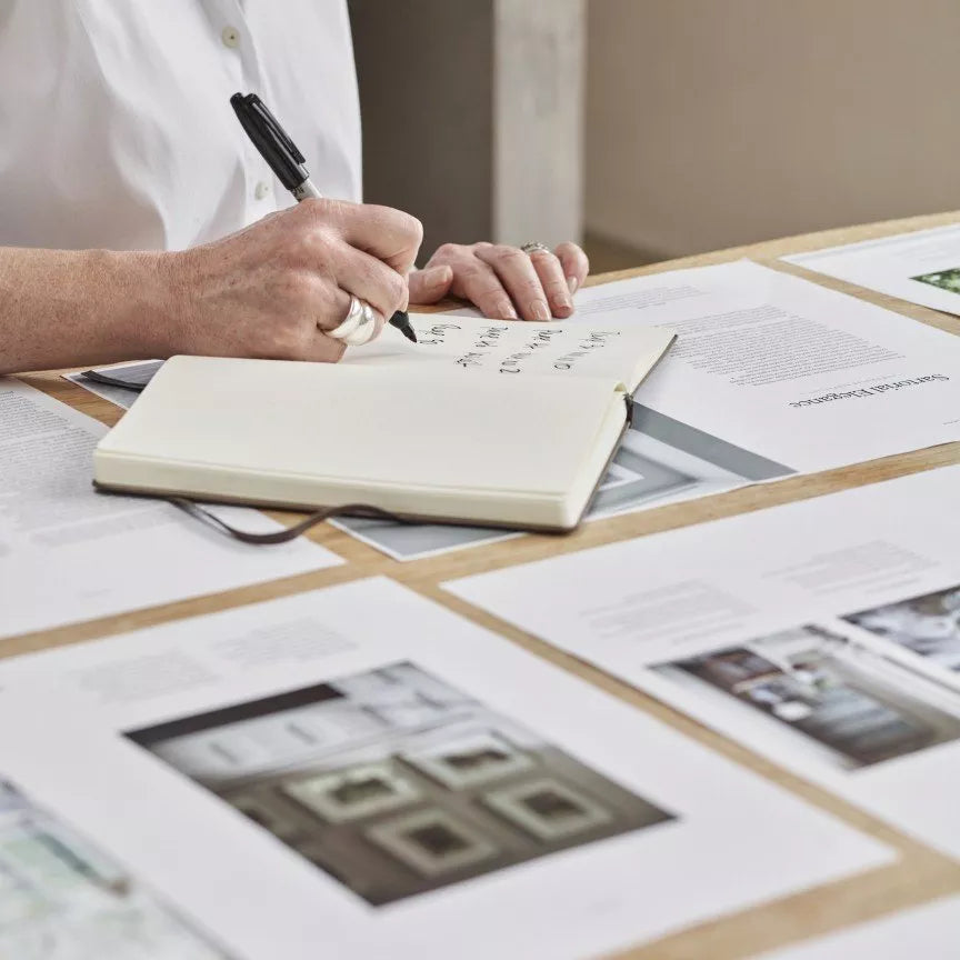 The Art of Living With White page spread showing a winter interior