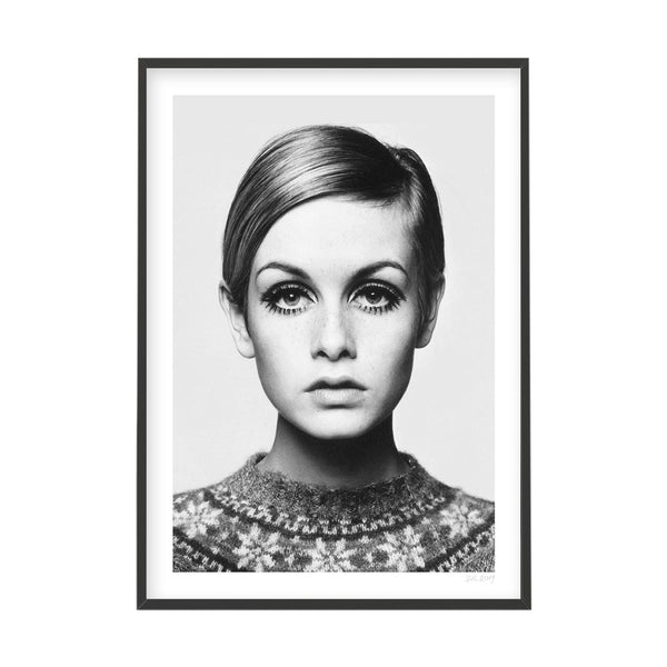 A black and white photo of a woman in a sweater, available for delivery as TWIGGY prints by Art Prints.