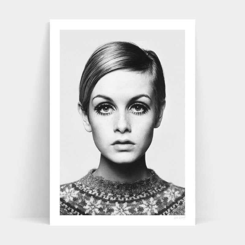 A black and white photo of a woman with big eyes available for TWIGGY Art Prints.