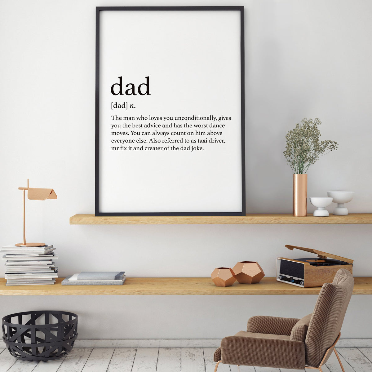 Dad print in a black frame on a timber shelf above a low bench