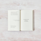 An open book with a quote on it, designed for those seeking inspiration and healing through lifestyle books called "All That You Deserve" by Jacqueline Whitney, published by Thought Catalog.