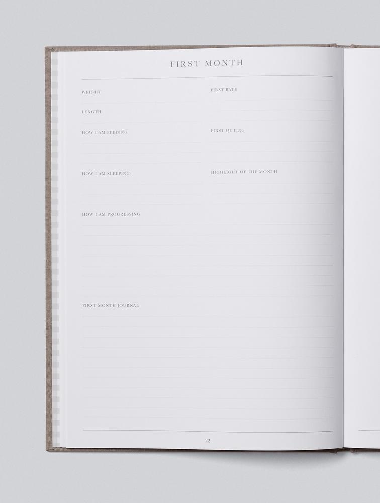 Open Write To Me Baby journal showing a guided page with prompts and photo space