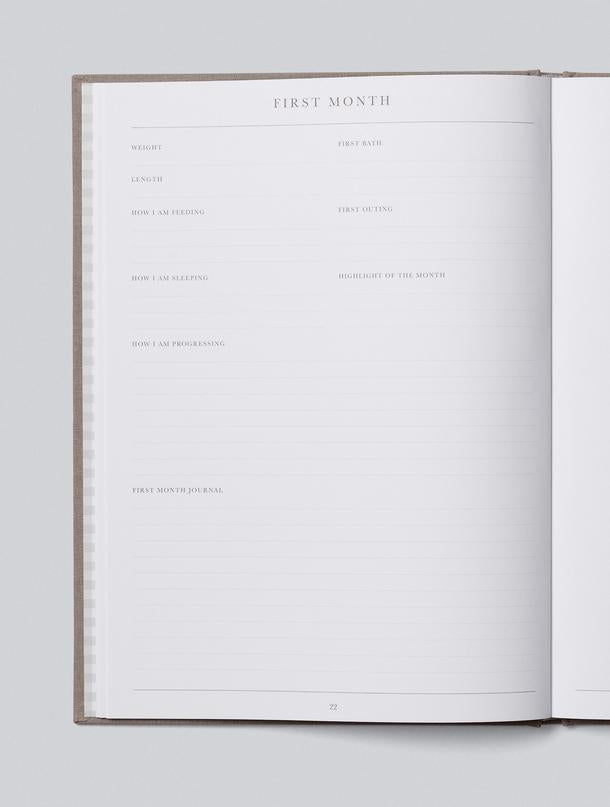 Open Write To Me Baby Journal showing a milestone page for recording the first five years