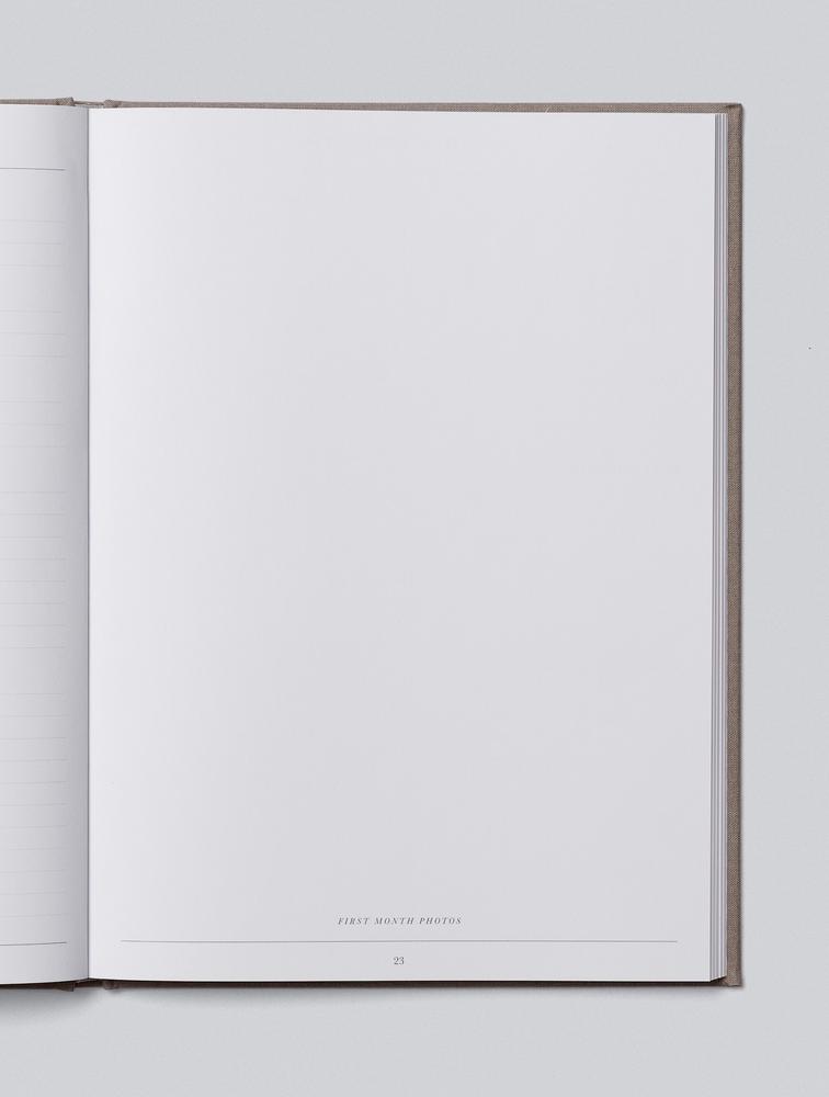 Open Write To Me Baby journal showing a blank page for free journalling