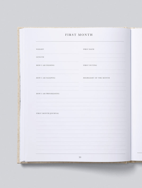 Open Write To Me baby journal showing a guided prompt page