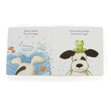 The "Puppy Makes Mischief Book" by Jellycat is a delightful board book featuring a dog and a frog having playful adventures in the rain.