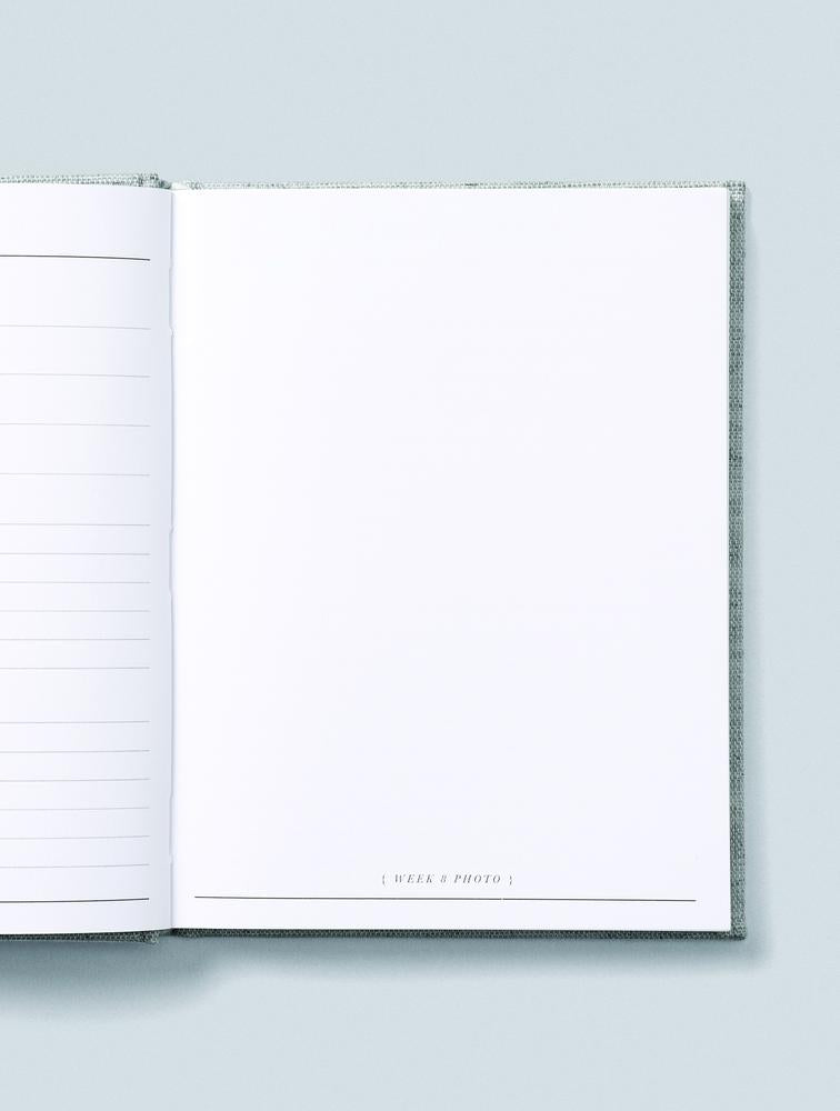 Bump journal open to a blank bump photo page on a pale blue background