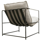 A special order item, the Scout Lounge Chair by Flux Home features a white cushion and metal frame.