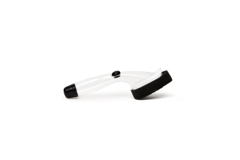 A pair of black and white eyeglasses on a white background, along with a Barkly Basics Scourer Pad Dish Stick that features a heavy-duty scourer head with a replaceable head.